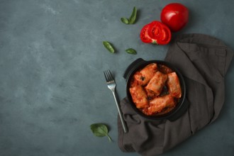 Stuffed cabbage rolls in tomato sauce stuffed cabbage leaves, minced meat with rice, on a dark