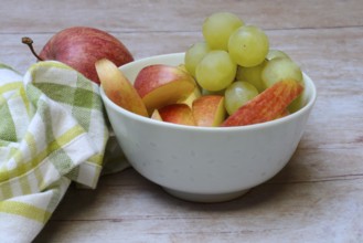 Apple slices and grapes in skin