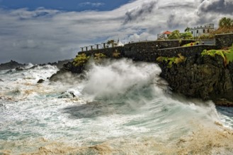 High waves on the rocks of Porto Moniz, surf on the Atlantic Ocean, storm, clouds, Porto Moniz,