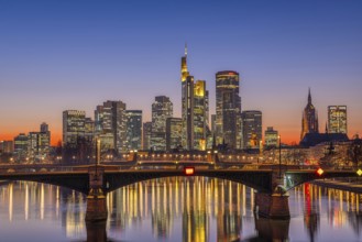 The lights of Frankfurt's banking skyline glow in the evening after sunset, Frankfurt am Main,