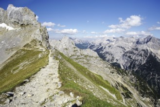 A hiking trail on a ridge with a view of a mountain landscape, Karwendel, Mittenwald, Bavaria,