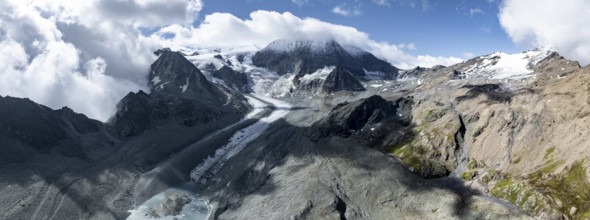 Aerial view, Alpine panorama, mountain landscape with glacier tongue Glacier de Cheilon and summit