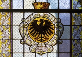 Stained glass window with the city coat of arms in the market church of St Cosmas and Damian,