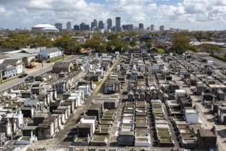 New Orleans, Louisiana - An aerial view of St. Joseph Cemetery #1, with the downtown skyline in the