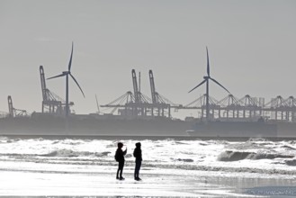 Silhouettes of wind turbines, harbour, people, beach, sea, Hoek van Holland, Rotterdam, Netherlands