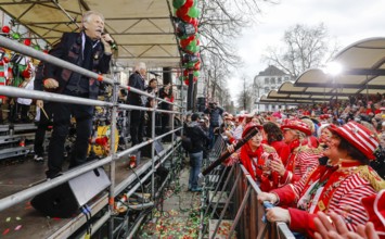 Colourfully costumed carnival revellers celebrate carnival in Cologne, on Weiberfastnacht the