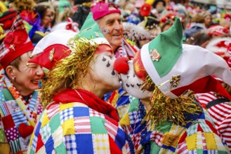 Colourfully costumed carnivalists celebrate carnival in Cologne, on Weiberfastnacht the street