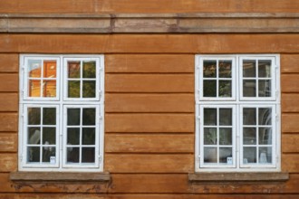 Windows with white frames, rust-red house, Frederiksholms Canal, Copenhagen, Denmark, Europe