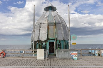 Metal pavilion at the end of a pier with sweeping sea views, Rügen