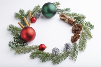 Christmas or New Year wreath composition. Decorations, balls, cones, fir and spruce branches, on