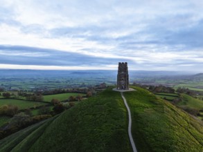 Sunrise over Glastonbury Tor from a drone at autumn, Glastonbury, Somerset, England, United
