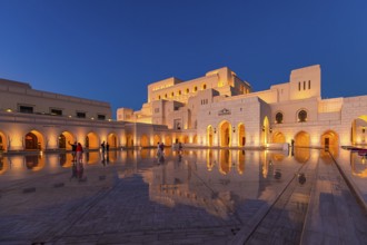 Visitors view the main square in front of the Royal Opera in the evening light, Muscat, Arabian