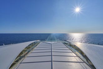 View from the ship's deck, Mein Schiff 6, of the vast sea under bright sunshine and blue skies,