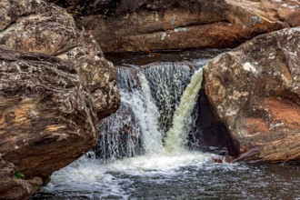 Stream and waterfall among the rocks of the Biribiri mountain range in Diamantina, Minas Gerais,