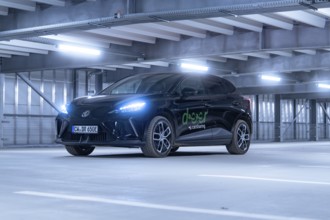 Black car with front lights switched on in car park, e-car sharing, Deer Mobility, MG4, Calw,