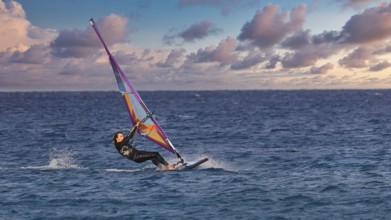 Sky exchanged, colourful windsurfer on the sea with vivid sky, windsurfer, Meltemi windsurfing