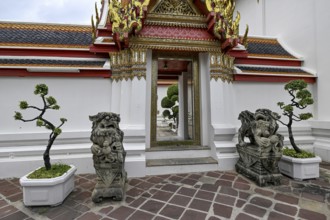 Stone statues of Chinese warriors, guardians, Wat Pho, Temple of the Reclining Buddha, Bangkok,