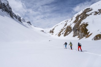 Ski tourer, Snowy mountain landscape, Bernese Alps, Bernese Oberland, Switzerland, Europe