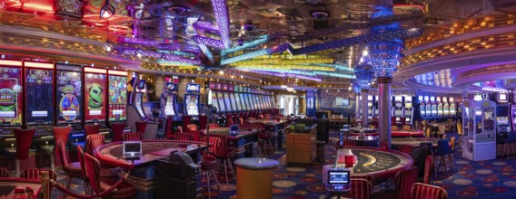 Las Vegas, Nevada, USA, March 10, 2024: Casino gambling blackjack and slot machines waiting for