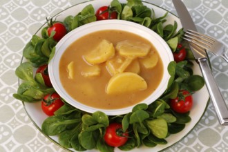 Swabian cuisine, sour potato wheels, potato slices in sour sauce, healthy cuisine, typical Swabian,