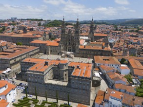 The cathedral is at the centre of the cityscape, surrounded by several historic buildings with