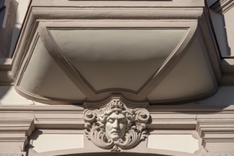 Relief of a head under a historic bay window, Würzburg, Lower Franconia, Bavaria, Germany, Europe