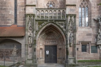 Main entrance portal of St Nicholas and St Ulrich Church, nave built around 1400, Kirchenberg 15,