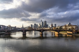 Skyline of the city centre of Frankfurt am Main, river Main, Ignatz-Bubis-Bridge, dusk, Hesse,