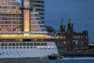 Cruise ship Aida Prima at the Cruise Terminal of Rotterdam, Kop van Zuid, skyscrapers at the