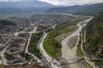 View looking over city centre of Berat in valley of River Osum with mountains beyond, Berat,
