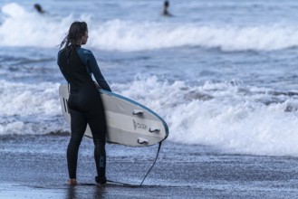 Surfer on the beach of Lanzarote
