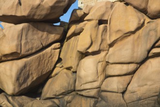 A face in stones. Lighthouse Mean Ruz at Ploumanach, Cotes d'Armor in the last evening light