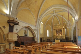 Interior view of Saint Michel church, pulpit, chancel with painting, pews, Salon-de-Provence,