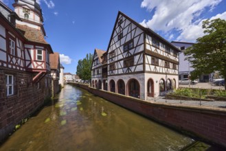 River Mümling, historic half-timbered houses, trees, blue sky with cumulus clouds, Erbach,