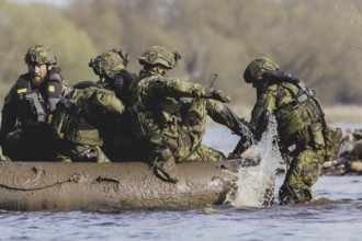 Soldiers on an inflatable boat, taken as part of the military exercise 'Wettiner Schwert' with
