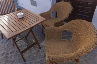 Table and chairs in the outdoor catering area, Vejer, Andalusia, Spain, Europe