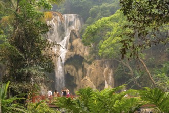 Tourists at Kuang Si waterfall near Luang Prabang, Laos, Asia