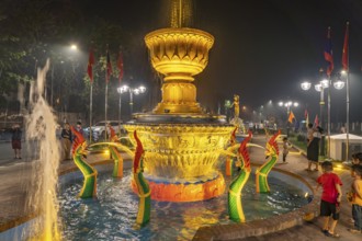 Illuminated fountain in Fountain Square Park in Luang Prabang, Laos, Asia