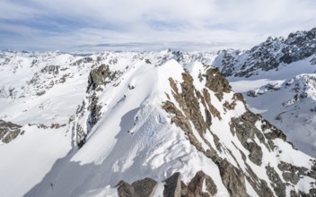 View from the summit of Piz Grialetsch in winter, mountain ridge with snow, Grisons Haute Route,
