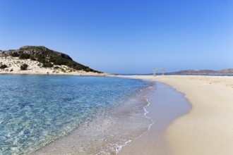 Crystal clear turquoise water, deserted dream beach in spring, Simos beach, Sarakiniko beach,