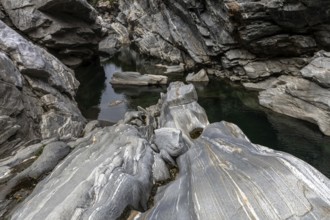 Rocks, granite rock formations in the Maggia River near Ponte Brolla, in the Maggia Valley, Valle