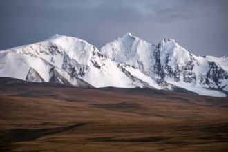 Glaciated and snow-capped mountains, dramatic landscape, high plateau, autumnal mountain landscape