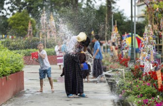 NAMSAI, INDIA.- APRIL 16: Devotees celebrate the vibrant Sangken Festival by pouring water over