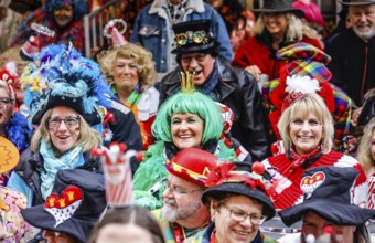Colourfully costumed carnivalists celebrate carnival in Cologne, on Weiberfastnacht the street