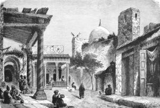 In the bazaar of a Turkish old town, street with shops, dome of a mosque, shady corridors, people,