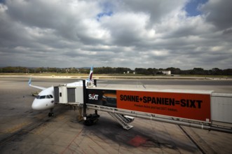 Aircraft Airbus A320 of the airline Eurowings GmbH at passenger boarding bridge or finger,