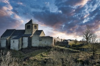 Dauzat-sur-Vodable. The Romanesque church of Saint-Géraud built on a basalt peak. Puy de Dome.