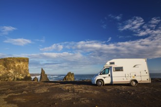 Motorhome parking on the shoreline, south of Sandvik with crashing waves. Rough nature