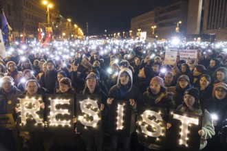 Sea of lights with Resist signs at the demonstration under the slogan Brandmauer statt Brandstifter
