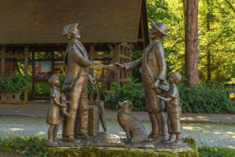 Sculpture next to the water well in the medieval mountain village of Sasbachwalden, Black Forest,
